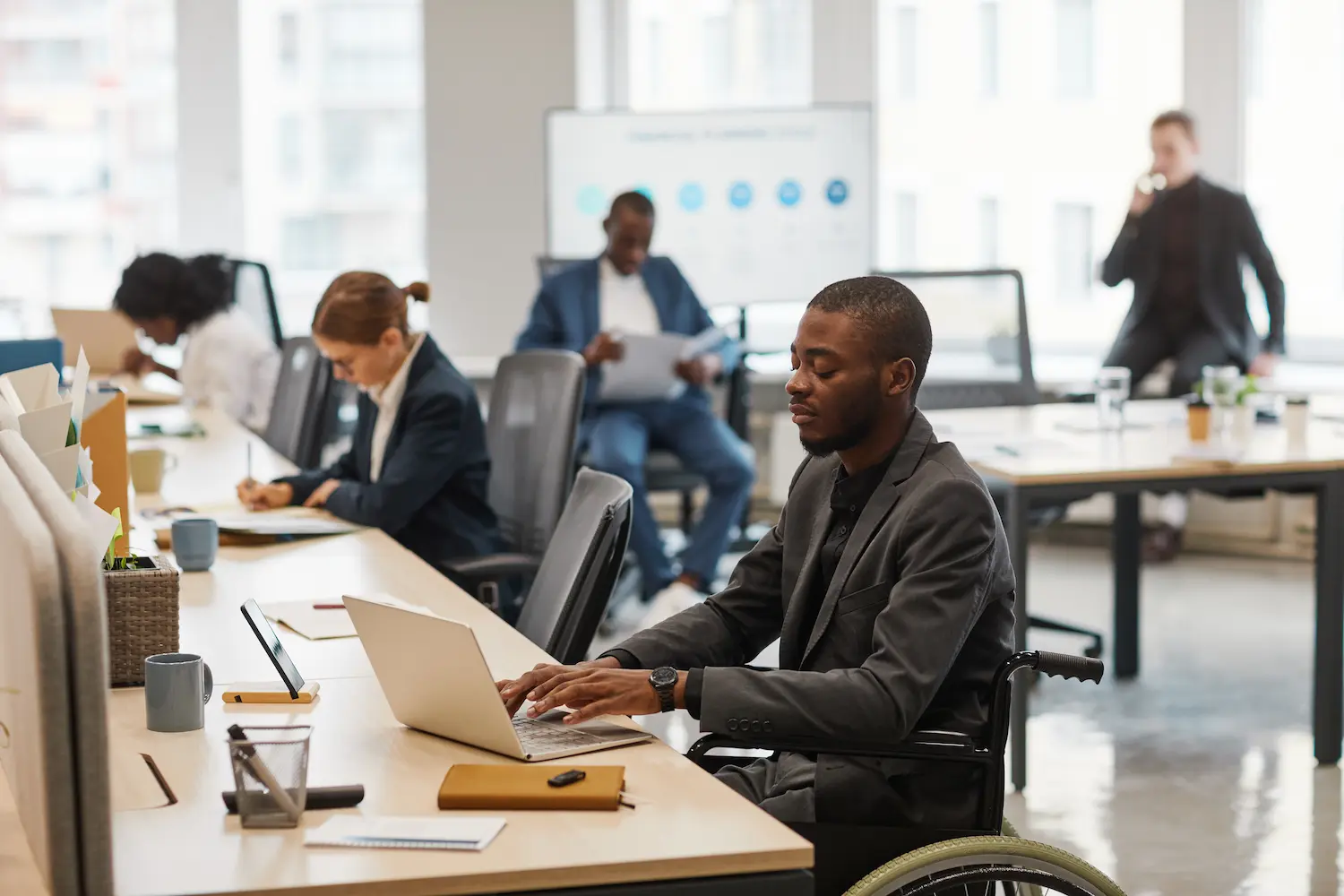 diverse male and female creative colleagues working